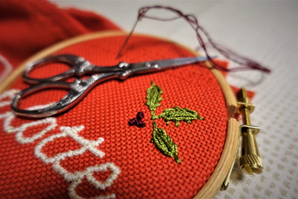 Hand embroidered St. Nick sacks with a small green leave