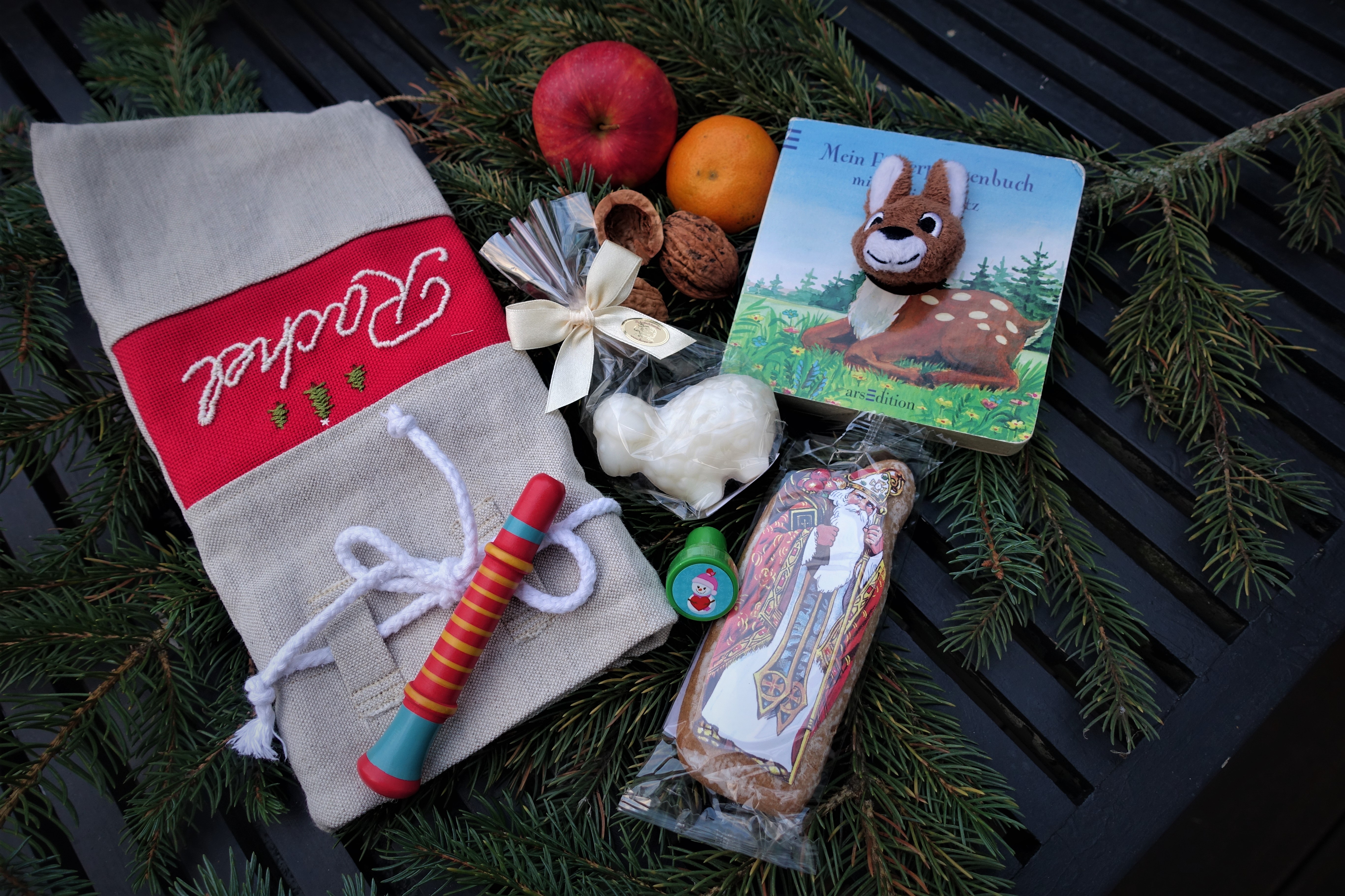 Ideas including ginger bread, stampers and a book, on how to fill the gift sack