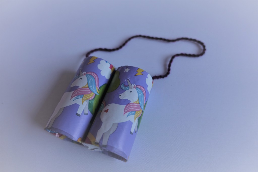 Completed purple unicorn binoculars made out of toilet paper rolls